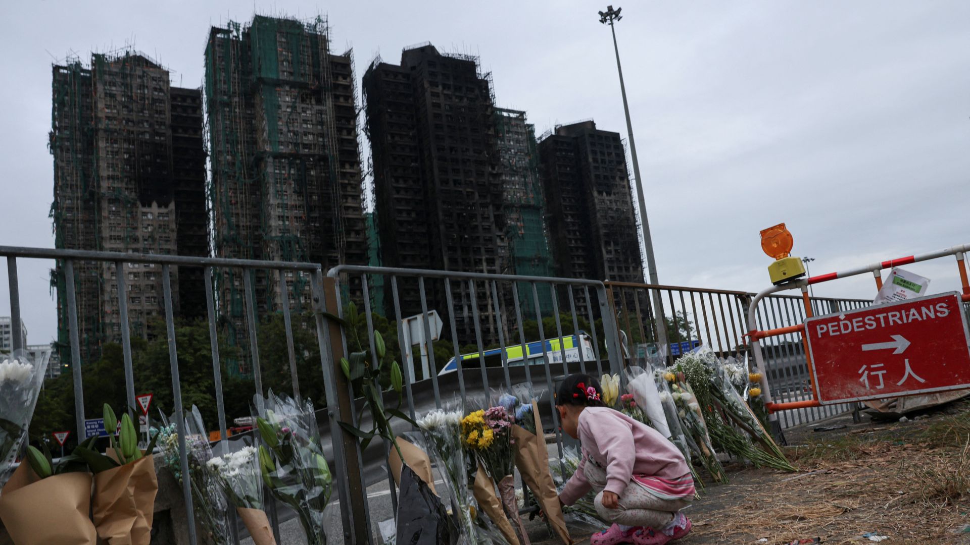 Death toll in Hong Kong apartment complex fire rises as more bodies found in burned buildings