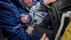 Nasa astronaut and cosmonauts return to Earth after 245 days in space