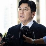 Mogul behind K-pop supergroup faces arrest