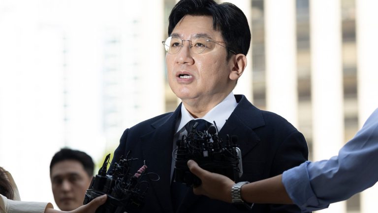 Mogul behind K-pop supergroup faces arrest