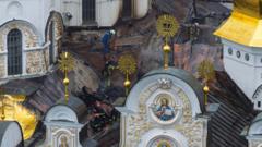Russian strikes kill nine and set historic cathedral in Kyiv ablaze