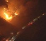 Watch: California wildfires rage near passing vehicles