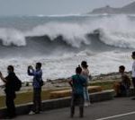 East Asia braces for destructive typhoon as landslides kill 15 in Philippines