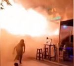 People flee Bangkok bar as huge flames shoot out from doorway