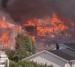Helicopters dump water as huge Norway fire destroys homes