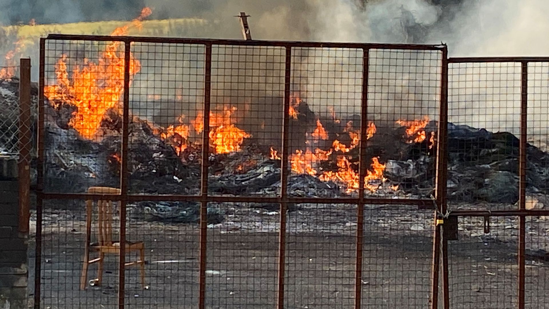Loyalist bonfire with mosque replica on top is set alight before bid to remove display