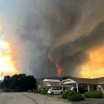State of emergency declared as fast-moving Canada wildfire doubles in size
