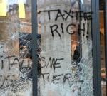 Burnt out cars and shattered glass on Paris streets after protests turn to riots and looting