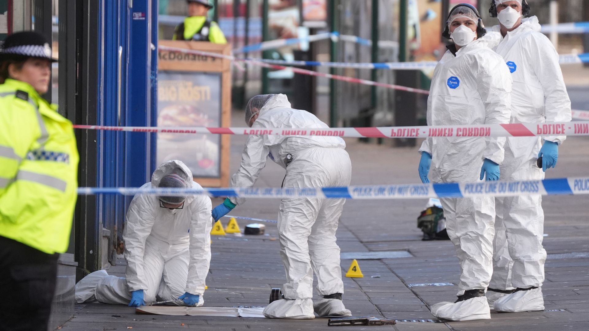 Two men and two women arrested after police officer shot